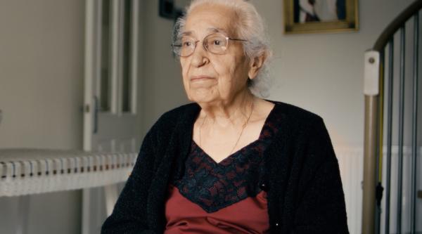 A lady sitting in her living room